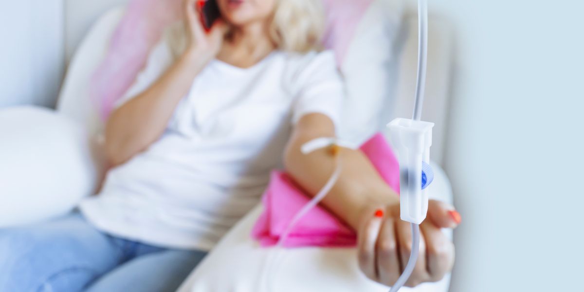 Person receiving IV therapy for cold and flu relief, highlighting hydration and immunity-boosting benefits.